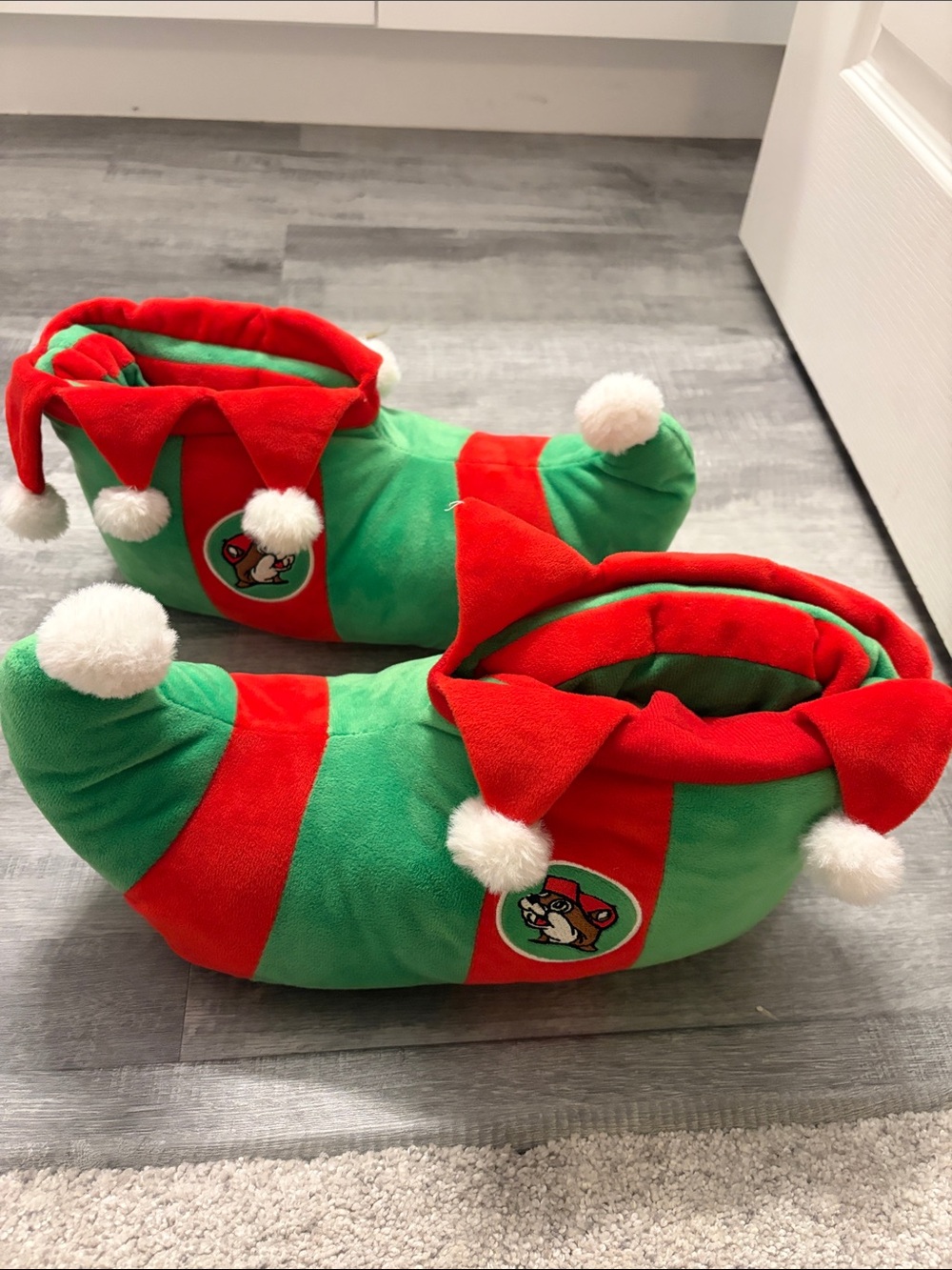 Christmas Elf Plush Slippers - Green & Red with Pom Poms. Buc-ee’s.